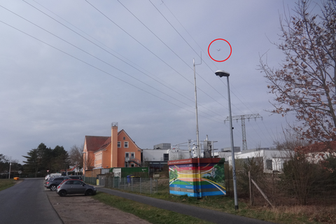 LfU monitoring station and TROPOS container in front of a school