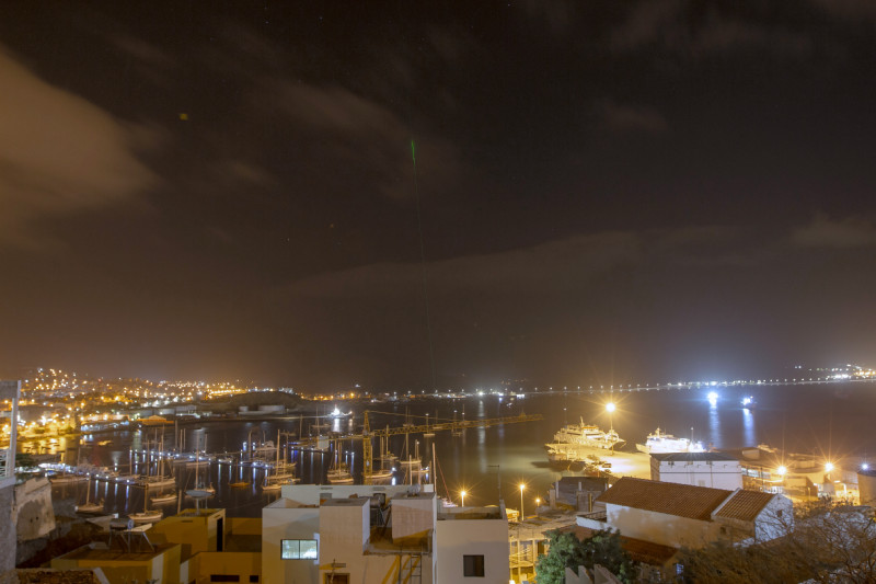 The green lasers of the two lidars from NOA and TROPOS can be seen far beyond the harbour at night. Photo: Edson Silva Delgado, Etfilmes / OSCM